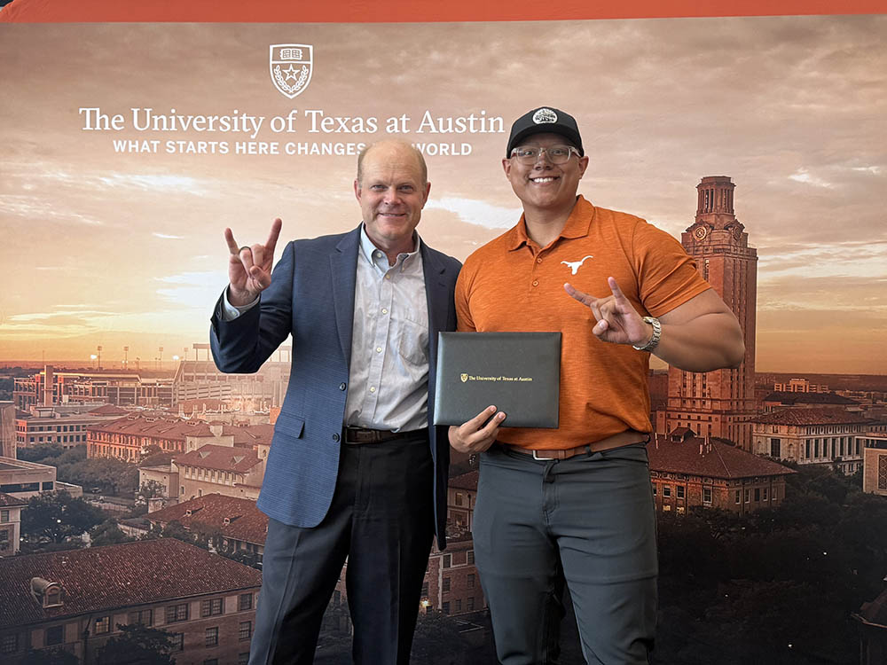 Dario Garcia (right) at TxEEE graduation reception with UT Mechanical Engineering Professor Eric Bickel